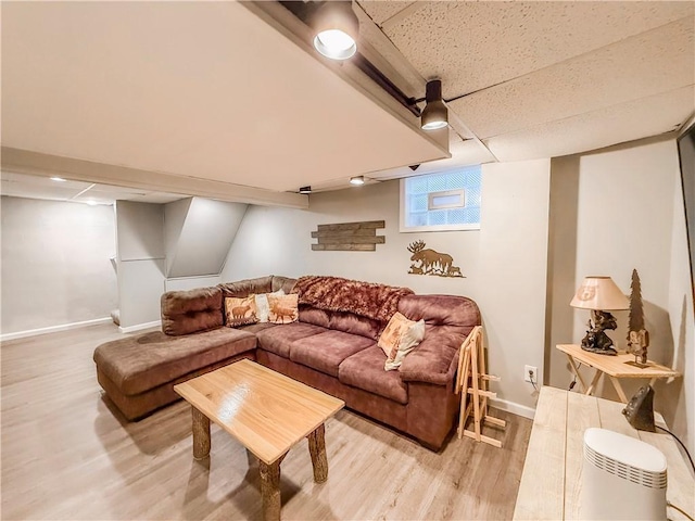 2787 Queensboro Ave, Baldwin Twp, PA 15226 - living area featuring light wood finished floors, baseboards, and a paneled ceiling