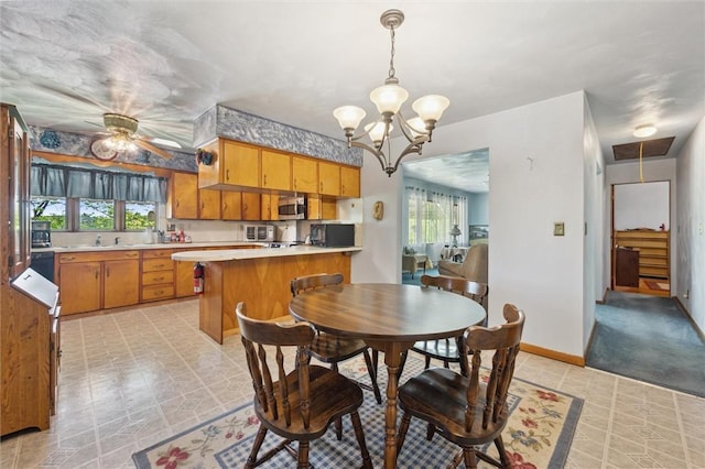 178 Sagamore Rd, Cowanshanock Twp, PA 16249 - dining room featuring healthy amount of natural light, a ceiling fan, a chandelier, and baseboards