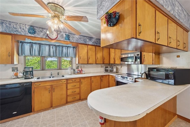 178 Sagamore Rd, Cowanshanock Twp, PA 16249 - kitchen with black appliances, a sink, light countertops, brown cabinets, and a peninsula