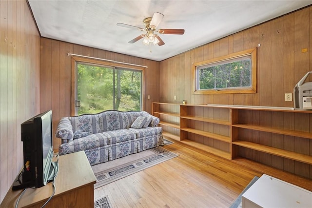 178 Sagamore Rd, Cowanshanock Twp, PA 16249 - living room featuring wood finished floors, a ceiling fan, and wooden walls