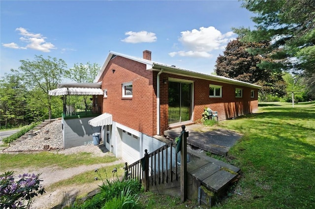178 Sagamore Rd, Cowanshanock Twp, PA 16249 - back of house featuring a garage, a yard, brick siding, a chimney, and stairway