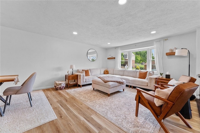 2406 Rolling Farms Rd, Shaler, PA 15116 - living area with light wood-style floors, a textured ceiling, and recessed lighting