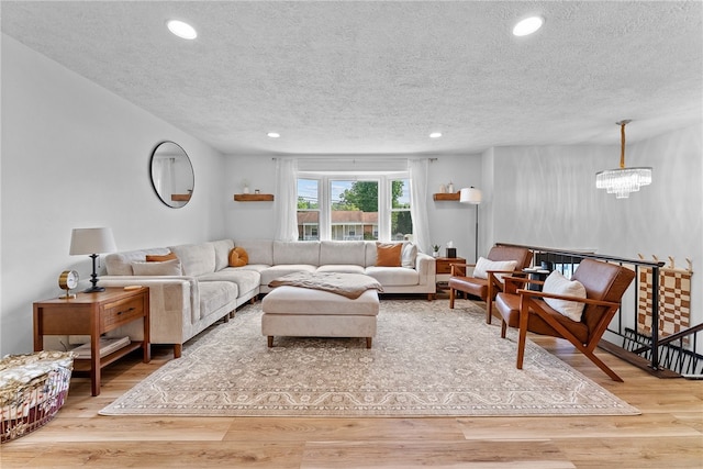 2406 Rolling Farms Rd, Shaler, PA 15116 - living area featuring a textured ceiling, wood finished floors, a chandelier, and recessed lighting