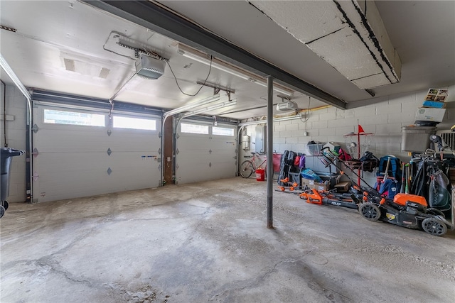 2406 Rolling Farms Rd, Shaler, PA 15116 - garage with a garage door opener and concrete block wall