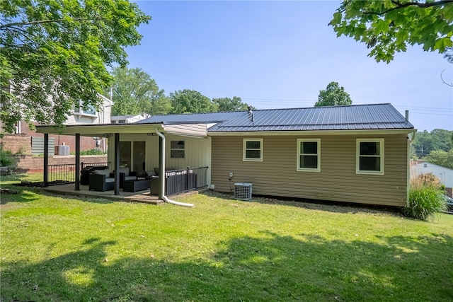 2406 Rolling Farms Rd, Shaler, PA 15116 - back of property featuring a yard, central AC unit, and metal roof