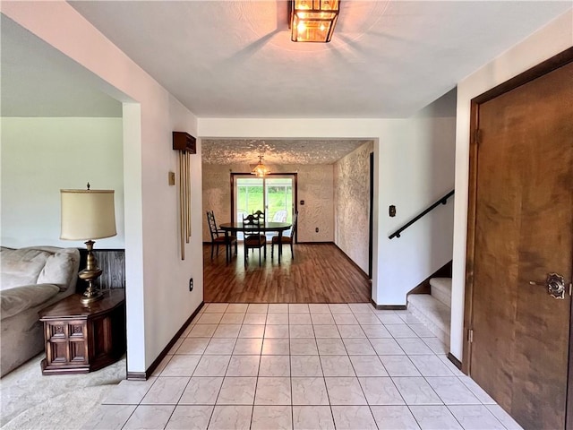 590 N Kings Creek Rd, Pa, PA 15021 - corridor featuring stairway, baseboards, and light tile patterned flooring