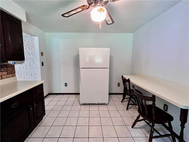 590 N Kings Creek Rd, Pa, PA 15021 - kitchen featuring freestanding refrigerator, ceiling fan, light countertops, and light tile patterned floors