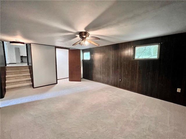 590 N Kings Creek Rd, Pa, PA 15021 - basement with plenty of natural light, wooden walls, carpet, a ceiling fan, and stairway