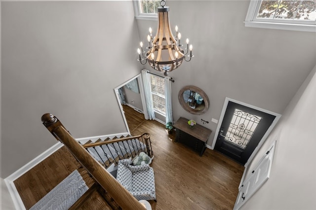 809 Timber Trl, Collier Twp, PA 15071 - entryway featuring a chandelier, healthy amount of natural light, wood finished floors, a towering ceiling, and baseboards