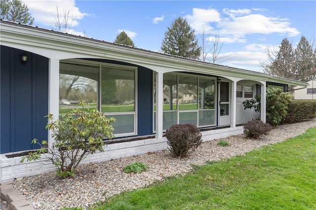 507 Moss Ln, Pymatuning Twp, PA 16125 - view of exterior entry with board and batten siding