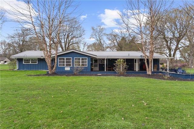 507 Moss Ln, Pymatuning Twp, PA 16125 - back of property featuring a yard, metal roof, and a sunroom