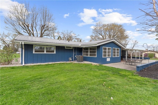 507 Moss Ln, Pymatuning Twp, PA 16125 - view of front of house featuring a patio, a front lawn, metal roof, and central AC
