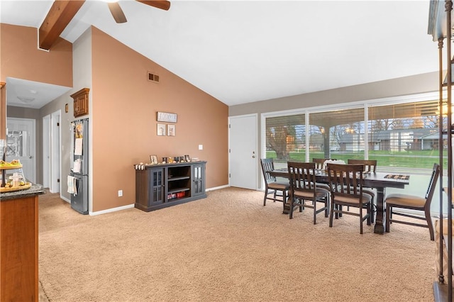 507 Moss Ln, Pymatuning Twp, PA 16125 - dining area with ceiling fan, high vaulted ceiling, light colored carpet, beamed ceiling, and baseboards