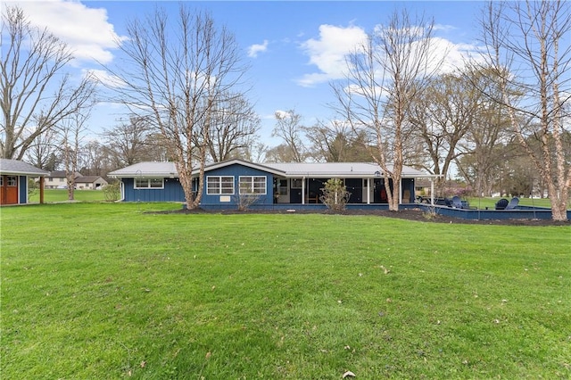 507 Moss Ln, Pymatuning Twp, PA 16125 - rear view of property featuring a sunroom and a yard