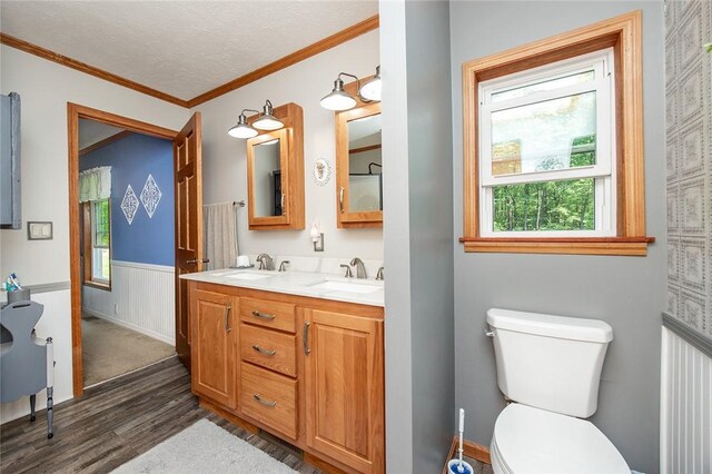 214 Fullingmill Rd, Jefferson Twp Mer, PA 16137 - bathroom featuring wood finished floors, healthy amount of natural light, a wainscoted wall, double vanity, and toilet