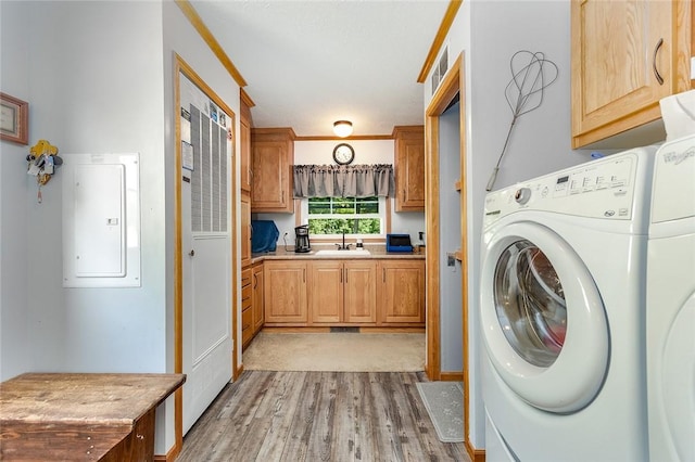 214 Fullingmill Rd, Jefferson Twp Mer, PA 16137 - laundry area featuring washer and clothes dryer, light wood-style flooring, electric panel, and cabinet space