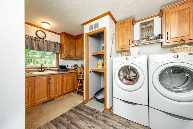 214 Fullingmill Rd, Jefferson Twp Mer, PA 16137 - laundry area featuring independent washer and dryer, cabinet space, dark wood finished floors, crown molding, and a textured ceiling