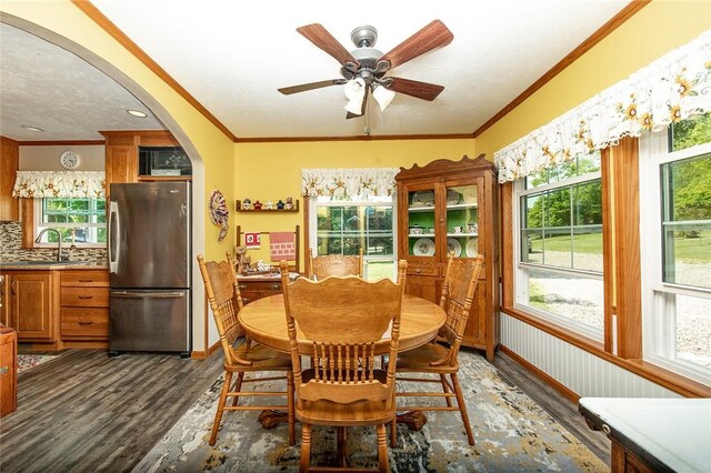 214 Fullingmill Rd, Jefferson Twp Mer, PA 16137 - dining space featuring wood finished floors, arched walkways, a ceiling fan, ornamental molding, and baseboards