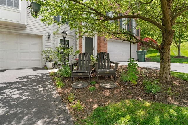 675 Village Green Blvd E, Adams Twp, PA 16046 - view of front of home with driveway, a garage, and brick siding