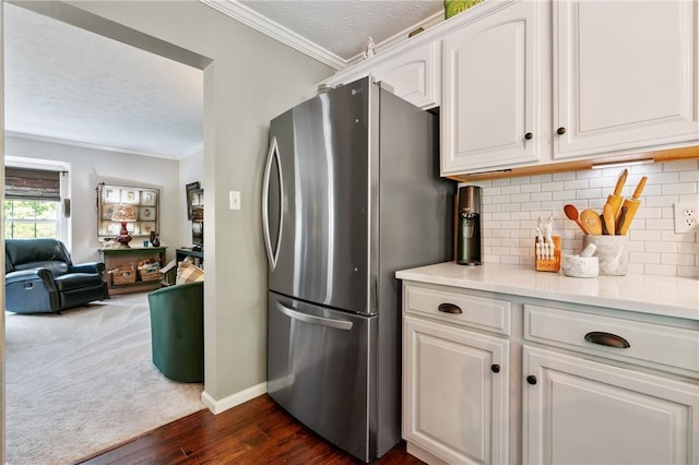675 Village Green Blvd E, Adams Twp, PA 16046 - kitchen featuring freestanding refrigerator, a textured ceiling, ornamental molding, tasteful backsplash, and white cabinets