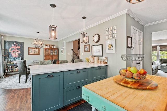675 Village Green Blvd E, Adams Twp, PA 16046 - kitchen with dark wood finished floors, a peninsula, light countertops, pendant lighting, and a chandelier
