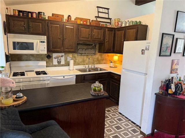 3025 Wallace St, Lower Burrell, PA 15068 - kitchen featuring white appliances, a sink, dark brown cabinets, and a peninsula