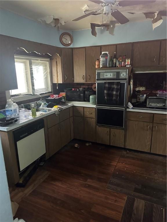 423 35th St, Mckeesport, PA 15132 - kitchen featuring black appliances, dark wood-style floors, light countertops, and ceiling fan