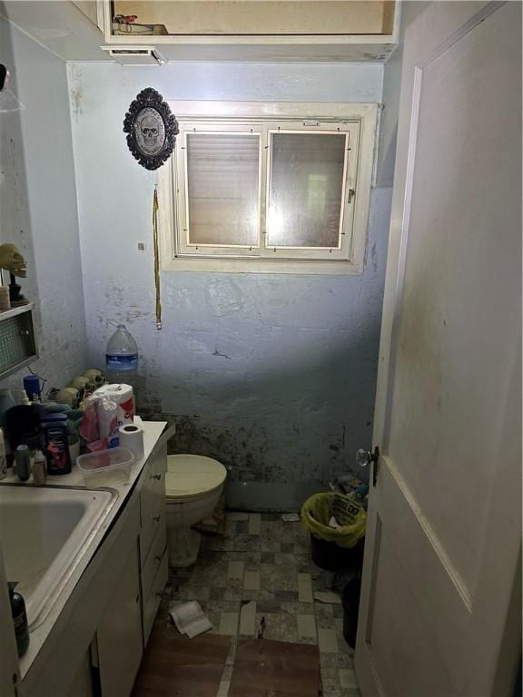 423 35th St, Mckeesport, PA 15132 - half bath with toilet, vanity, and tile patterned floors