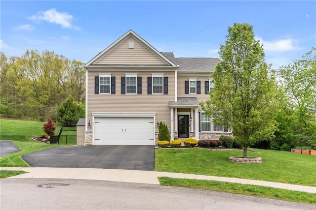 108 General Ct, Jackson Twp But, PA 16063 - view of front of home featuring stone siding, an attached garage, asphalt driveway, and a front lawn