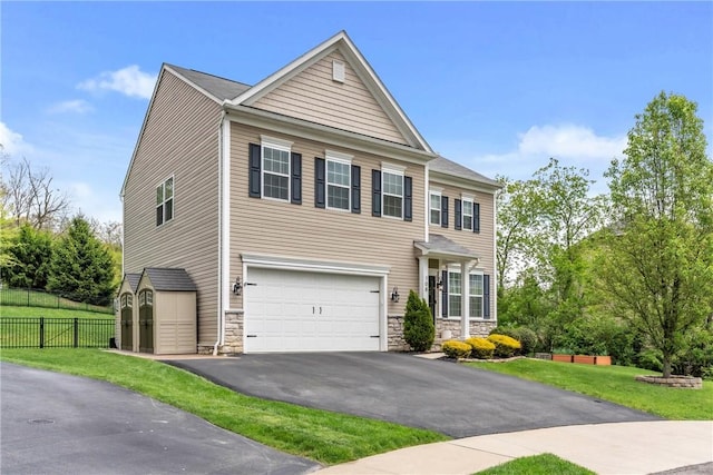 108 General Ct, Jackson Twp But, PA 16063 - view of front of house featuring stone siding, a garage, asphalt driveway, and a shed