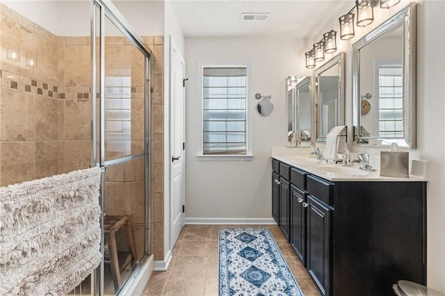108 General Ct, Jackson Twp But, PA 16063 - bathroom featuring double vanity, tile patterned flooring, a stall shower, and healthy amount of natural light
