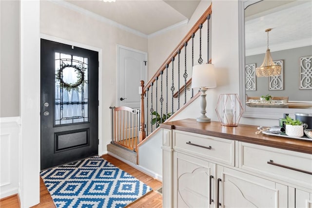 108 General Ct, Jackson Twp But, PA 16063 - foyer with light wood-type flooring, ornamental molding, and stairs