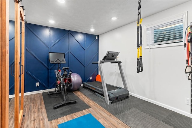 108 General Ct, Jackson Twp But, PA 16063 - workout area featuring a barn door, baseboards, wood finished floors, and recessed lighting