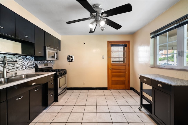 1624 Rockford Ave, Brookline, PA 15226 - kitchen with stainless steel appliances, dark cabinetry, a sink, decorative backsplash, and ceiling fan