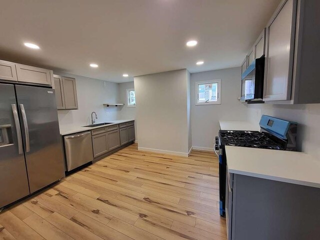 74 S Morgantown St, Fairchance, PA 15436 - kitchen with stainless steel appliances, a sink, light wood finished floors, recessed lighting, and light countertops