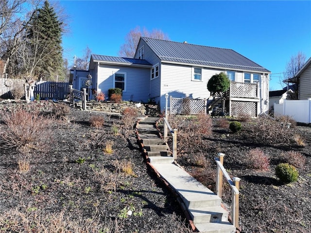 114 Bebout Rd, Peters Twp, PA 15367 - rear view of house with a standing seam roof, metal roof, and stairs