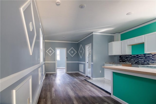624 Wylie Ave, Jeannette, PA 15644 - kitchen featuring ornamental molding, white cabinets, backsplash, dark wood-type flooring, and wood counters