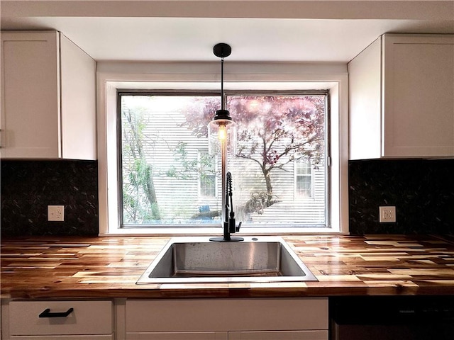 1218 Finch St, New Castle/4Th, PA 16101 - kitchen featuring butcher block counters, a sink, dishwasher, and decorative backsplash