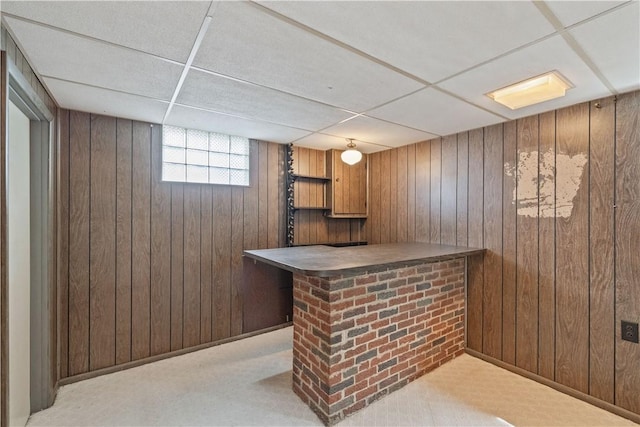 124 Wyndfield Dr, East Huntingdon, PA 15666 - indoor dry bar with wooden walls, a drop ceiling, and carpet
