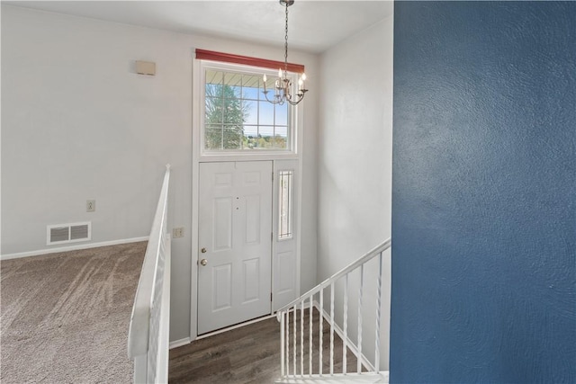124 Wyndfield Dr, East Huntingdon, PA 15666 - foyer entrance with a chandelier and baseboards