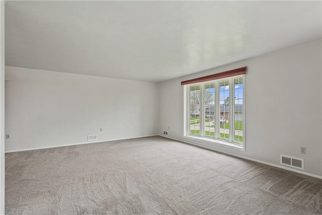 124 Wyndfield Dr, East Huntingdon, PA 15666 - carpeted spare room featuring baseboards