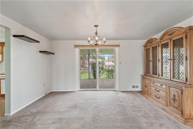 124 Wyndfield Dr, East Huntingdon, PA 15666 - unfurnished dining area with a chandelier, carpet, and baseboards