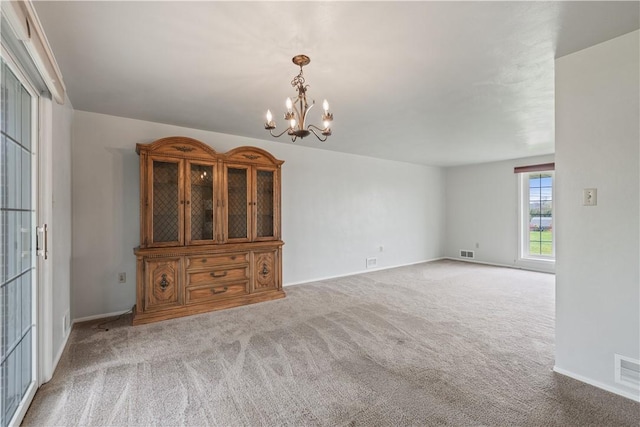 124 Wyndfield Dr, East Huntingdon, PA 15666 - spare room with carpet, a chandelier, and baseboards