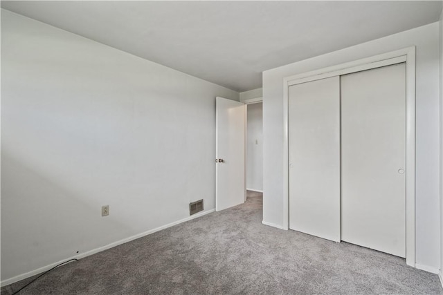124 Wyndfield Dr, East Huntingdon, PA 15666 - unfurnished bedroom featuring carpet flooring, baseboards, and a closet