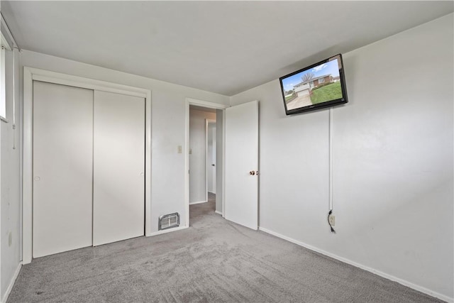 124 Wyndfield Dr, East Huntingdon, PA 15666 - unfurnished bedroom featuring carpet floors, a closet, and baseboards