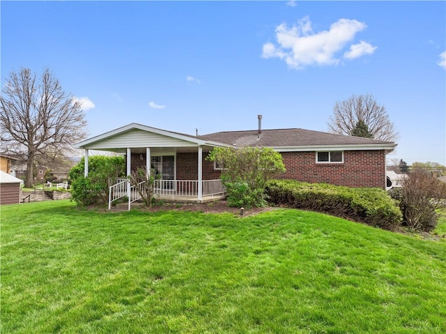 124 Wyndfield Dr, East Huntingdon, PA 15666 - view of front of home with brick siding and a front yard
