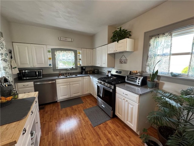 1172 Oak St, Indiana Boro Ind, PA 15701 - kitchen featuring appliances with stainless steel finishes, a sink, white cabinetry, wood finished floors, and butcher block countertops
