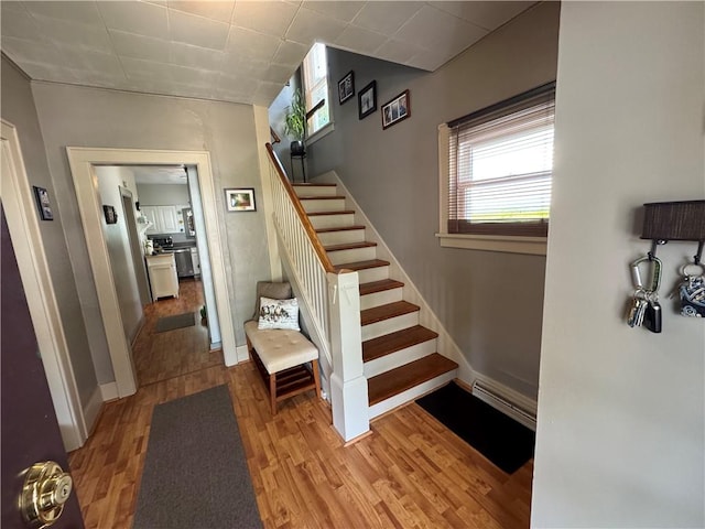 1172 Oak St, Indiana Boro Ind, PA 15701 - staircase featuring healthy amount of natural light, wood finished floors, baseboards, and baseboard heating