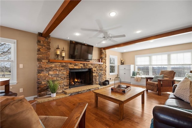 1299 Oakridge Rd, South Fayette, PA 15057 - living area with beam ceiling, ceiling fan, a stone fireplace, wood finished floors, and recessed lighting