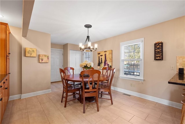 1299 Oakridge Rd, South Fayette, PA 15057 - dining space featuring a chandelier and baseboards